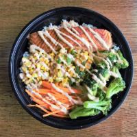 Salmon Bowl · Grilled Cajun Salmon, corn salsa, shredded carrot and grilled broccoli over rice drizzled wi...