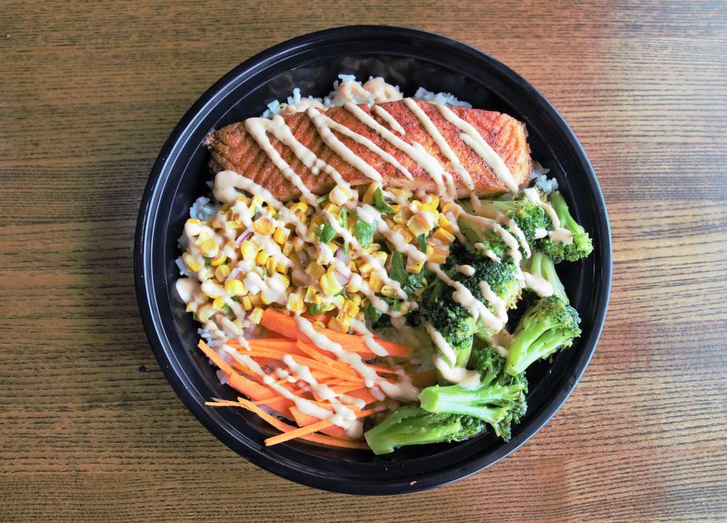 Salmon Bowl · Grilled Cajun Salmon, corn salsa, shredded carrot and grilled broccoli over rice drizzled with homemade chipotle mayo. 