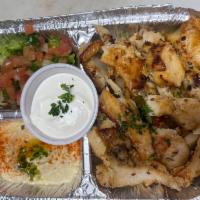Chicken Shawarma Plate · Chicken breast meat marinated, basmati rice, house salad, hummus dip, pita bread, and garlic...