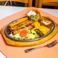 Mazatlan Combo · Beef taquito, pork taquito, chicken taquito, guacamole, and sour cream.