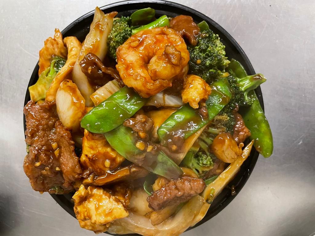 D3. Triple Delight · Chicken, shrimp, beef with broccoli, bok choy, water chestnut, mushroom and snow pea in a chef's sauce.