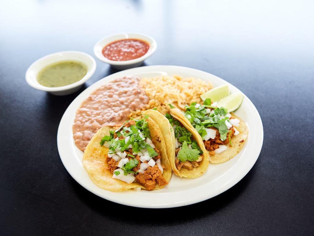 3 Piece Corn Tacos Plate · Served with rice, beans, onions and cilantro on the side and choice of meat.