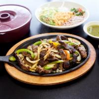 Fajita Plate · Beef fajita, onions, bell pepper, served with rice, beans, guacamole, pico de gallo, sour cr...