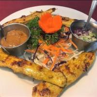 Chicken Satay · 4 pieces. Tender strips marinated in spices and grilled on skewers, served with Thai peanut ...