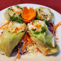Veggie Spring Rolls · 2 pieces. Lettuce, carrots, bean sprouts, and rice noodles wrapped in rice paper. Served wit...