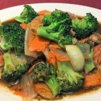 Beef Broccoli · Beef with sauteed broccoli, mushrooms, carrots, and white onions in brown sauce. Served with...