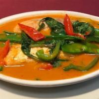 Salmon Curry  · Fillet of salmon cooked in red curry paste, coconut, bell pepper, snow peas, and basil leave...