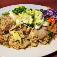 Combination Fried Rice · Chicken, beef and pork fried rice tossed with eggs, tomatoes, and onions. 