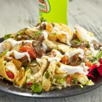 Nachos Mazatlan · Bomb nachos grilled with steak, chicken, shrimp, onions, and tomatoes covered with our delic...