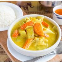 C2. Yellow Curry · Potatoes, carrots, and onions simmered in yellow curry sauce and coconut milk.