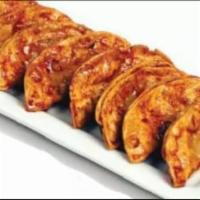 Potstickers · 8 lightly fried pork and vegetable dumplings brushed with choice of Bonchon signature sauce.