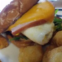 Bacon Egg and Cheddar Sandwich  · 2 fried eggs, arugula, tomato and mayo on brioche