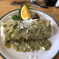 El Dorado Burrito Breakfast ·  scrambled eggs, potatoes, pork chorizo and sliced tomato wrapped up with salsa verde, jack ...
