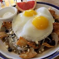 Chilaquiles Breakfast · Cinnamon dusted tortilla chips, salsa verde, black beans, cilantro, cotija and 2 eggs any st...