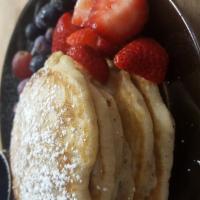 Kid's Silver Dollar Pancake Stack · Syrup and powdered sugar. Served with a side