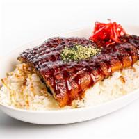 Unagi Don · Grilled whole unagi fillet served over a bed of rice with unagi sauce, and side Japanese sal...