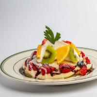 Mixed Fruit & Chocolate Pancakes · Served with an abundant assortment of fruits topped with a sweet creme anglaise