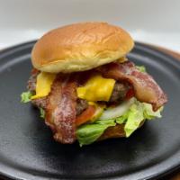 Bacon Double Cheeseburger · On a butter bun. Lettuce, tomato, pickle, onion, ketchup, and mustard.