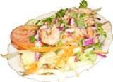 The Monster - Plah Goong · Grilled medium-rare shrimp seasoned with lime juice and fresh chili, served on a bed of lett...