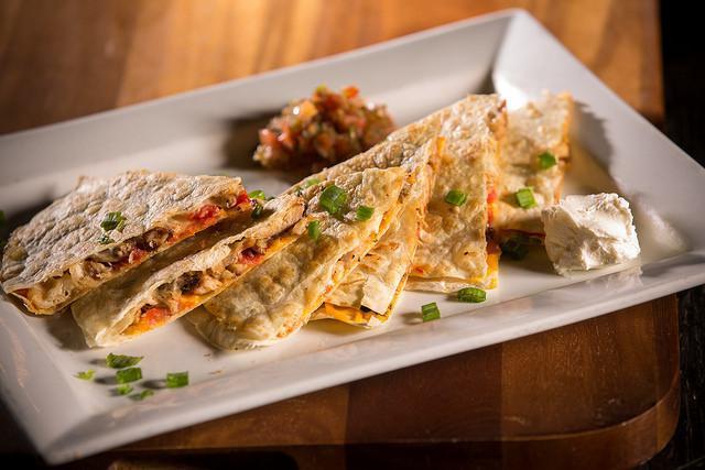 Roasted Chicken Quesadilla · Diced tomatoes, pepper jack and cheddar cheese in a flour tortilla served with sour cream and salsa. 