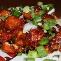 Gobhi Manchurian ·  Indo-Chinese dish made of deep-fried cauliflower  dumplings tossed in spicy Indo-Chinese sa...