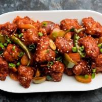 Chilli Chicken  · Fried chicken tossed in sauce made with hot sauces, onion, and peppers.