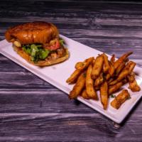 Grilled Chicken Sandwich · Grilled or battered and fried then tossed in sauce. Served with cheese, lettuce, tomatoes, o...