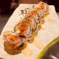 34. Crunchy Salmon Roll · Salmon, cream cheese, avocado, and masago deep fried with spicy mayo and wasabi sauce.