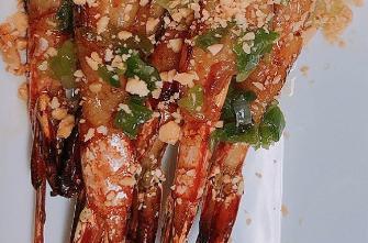 6 Shrimp Skewered · Marinated shrimp, topped with peanuts and scallion oil, served with a sweet and tangy sauce.