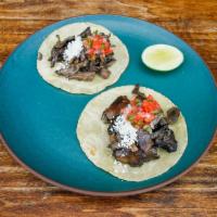 Hongos taco.  · Roasted mixed mushrooms, jalapeño salsa, pico de Gallo.