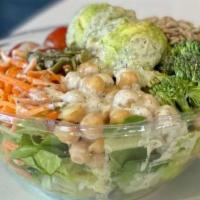 Avocado Protein Salad Bowl · Romaine, Carrots, Cucumber, Cherry Tomatoes, Broccoli, Tahini Chickpeas, Sunflower Seeds, Al...
