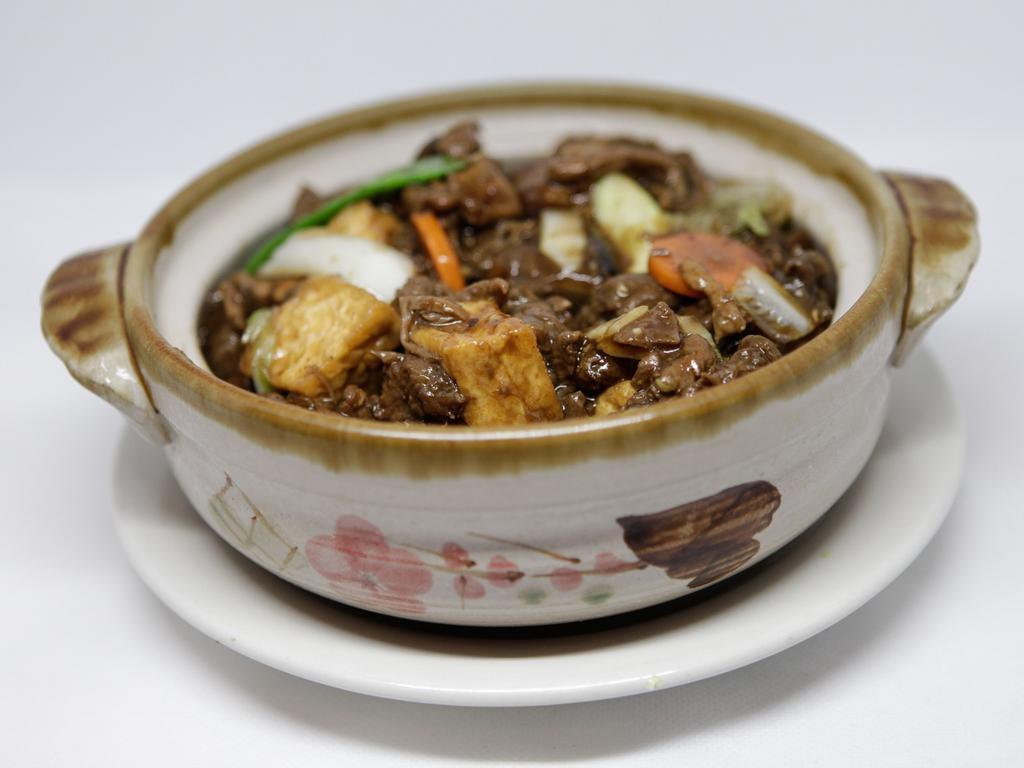 AC6. Beef Stew in Hot Pot · Chinese style beef stew with fried bean cake, fresh bean curd, Chinese mushrooms and vegetables stewed in hotpot.
