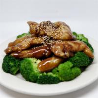AC17. Chicken Strips with Teriyaki Sauce · Tender breaded chicken with teriyaki sauce, topped with sesame seeds and crowned with brocco...
