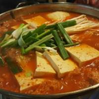 Kimchee Jjigae  · Spicy kimchee stew soup with tofu, vegetables and steamed rice.