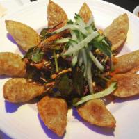 Bi Bim Mandu · Deep fried dumplings and vegetable mixed with house spicy sauce.