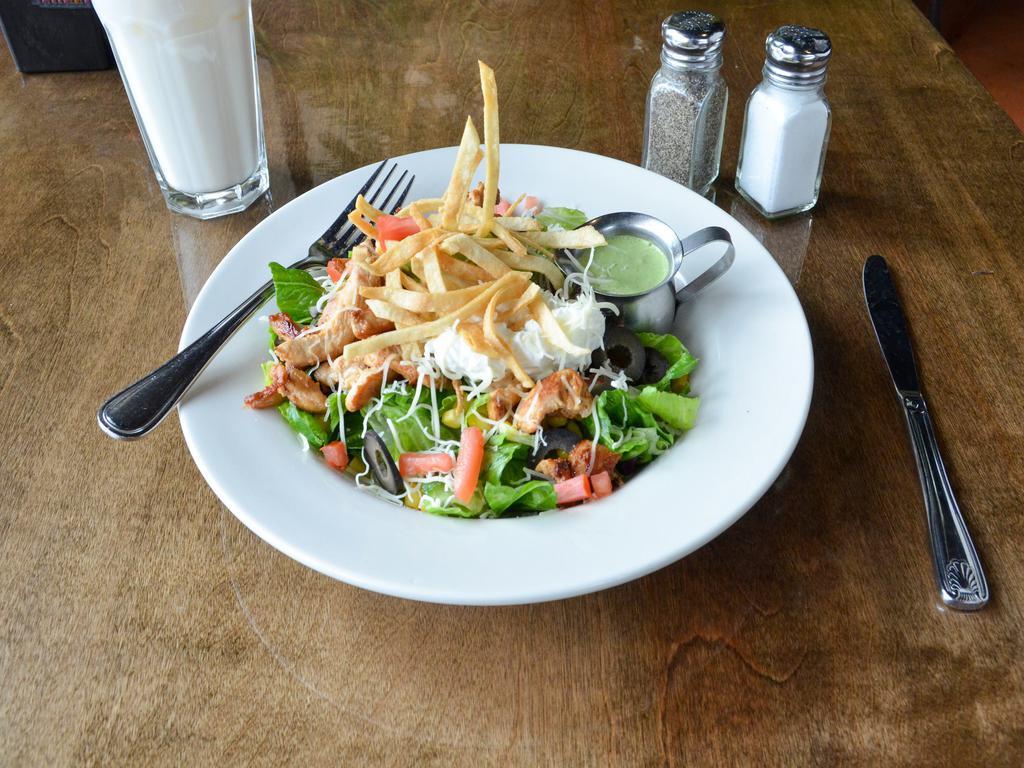 Santa fe Chicken Salad All Day · Lettuce, tomatoes, sweet corn, black beans, crispy tortilla strips, and jack cheese topped with guacamole, sour cream, black olives, and cilantro dressing.