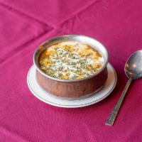 65. Daal Makhani · Black lentils cooked over night in ginger tomato with touch of cream.