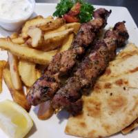 Pork Souvlaki Platter · Double portion of meat served with one side dish, pita bread and tzatziki. 