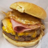 Western Burger · Egg over easy, ham, fried onions, jalapenos and cheddar cheese. 