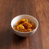 ALOO GOBHI · Cauliflower & potatoes in onion gravy tossed with
herbs and spices