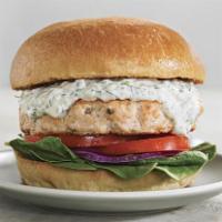 Salmon Burger · Seasoned hand chopped salmon patty with dill sauce in a brioche bun and served with french f...