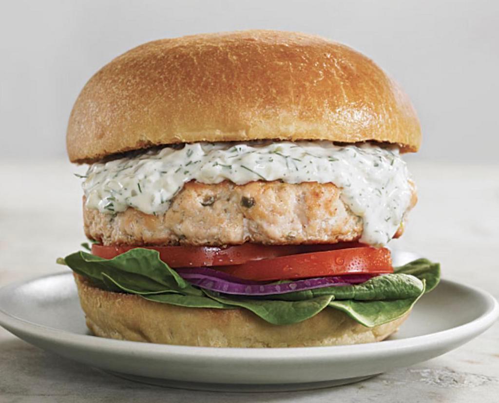 Salmon Burger · Seasoned hand chopped salmon patty with dill sauce in a brioche bun and served with french fries.