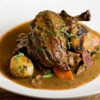 Coq au Vin · 1/2 Chicken braised in red wine sauce served with mushrooms, pearl onions, carrots and potat...