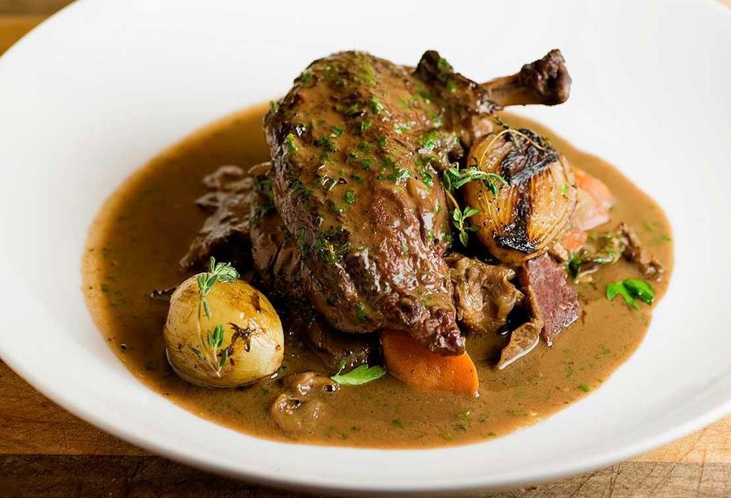 Coq au Vin · 1/2 Chicken braised in red wine sauce served with mushrooms, pearl onions, carrots and potatoes.