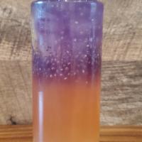 Berry Twilight · Strawberry peach green tea with blue chai tea, topped with aloe vera
