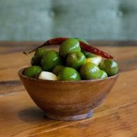 Sicilian Green Olives · Castelvetranos, pickled garlic, hot pepper, and Sicilian oregano.