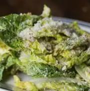 AP Caesar Salad · Little gem lettuces, parm breadcrumbs, lemon, and anchovy dressing.