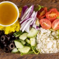 Greek Salad · Romaine, black olives, tomatoes, cucumbers, banana peppers, red onion, feta cheese and Greek...