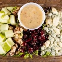 Harvest Salad · Mixed greens, blue cheese, walnuts, cranberries, apples and cobb dressing.