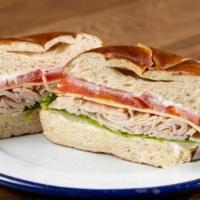 Turkey and Gouda Sandwich Combo  · Pretzel roll, boar's head turkey, Gouda cheese, lettuce, tomato and mayo. Served with chips ...